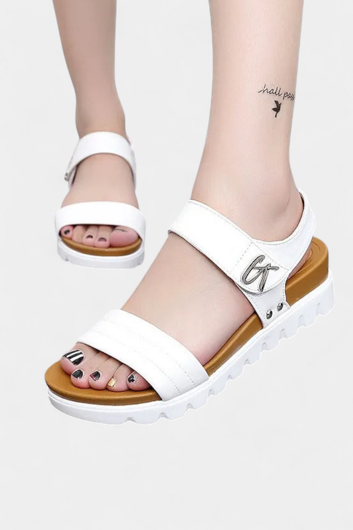 Gabby perforated synthetic leather sandals with floral detail
