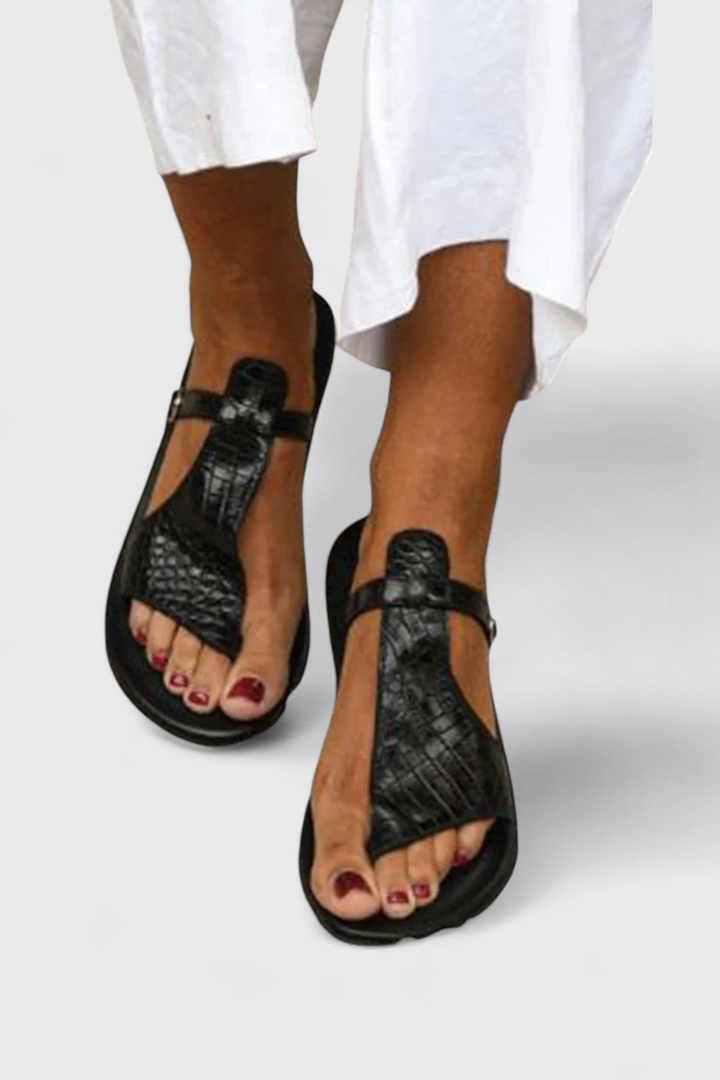 Tavia Black buckle sandals with embossed Animal Print detail